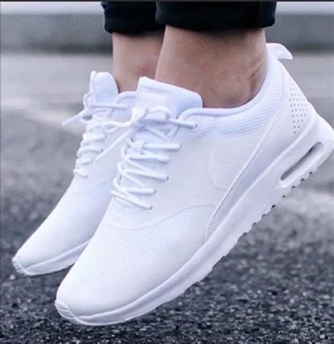 all white nike women's shoes.